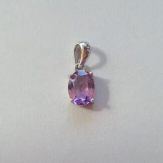 Jemagic amethyst pendant on silver background