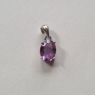 Jemagic amethyst pendant on silver background