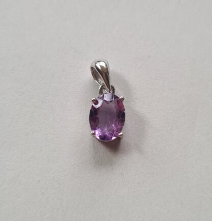 Jemagic amethyst pendant on silver background
