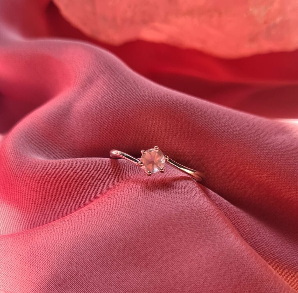 Jemagic rose quartz ring on pink silk