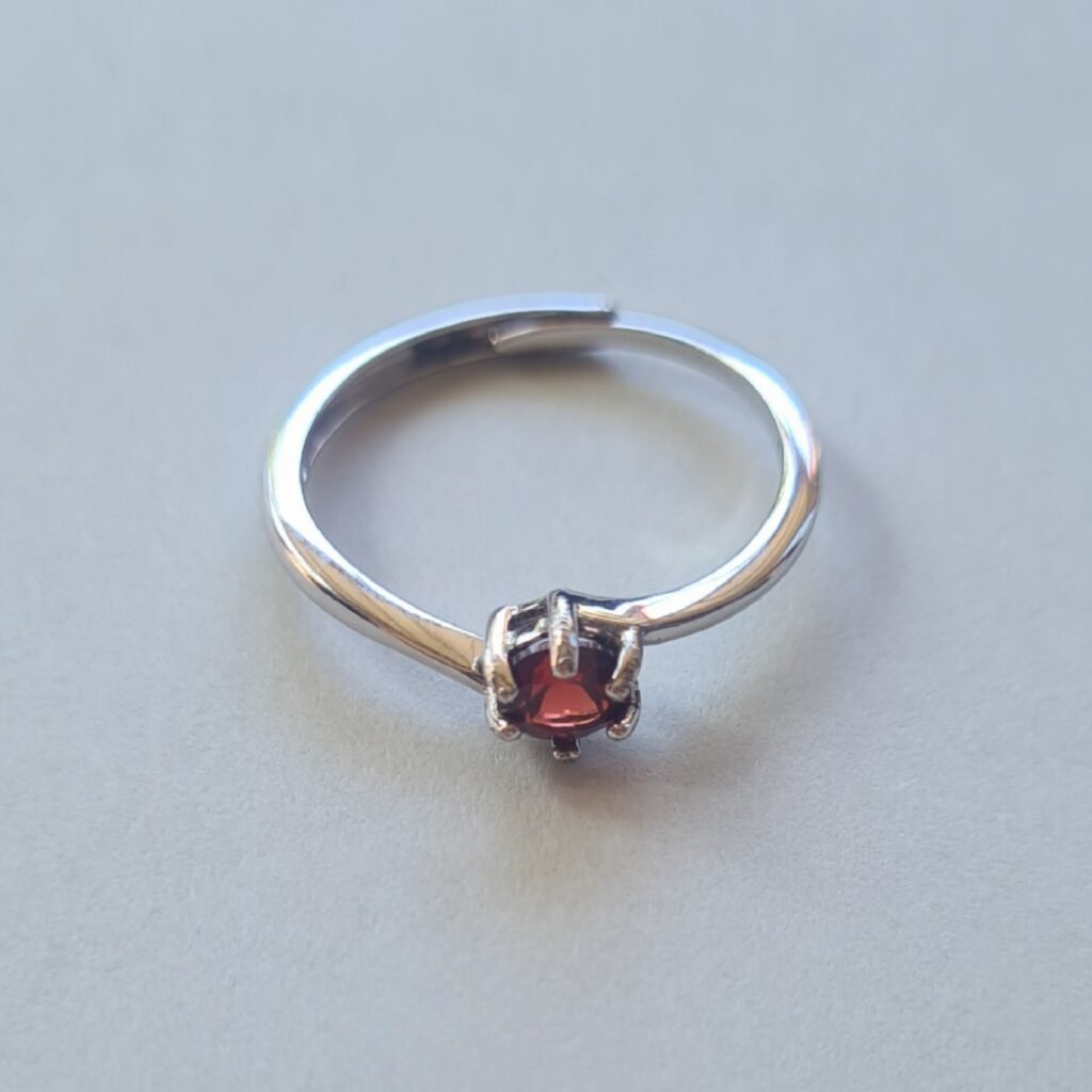 5mm Jemagic garnet ring on silver background