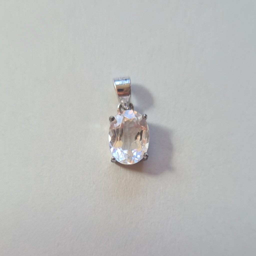 Jemagic white topaz pendant on silver background