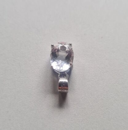 Jemagic white topaz pendant on silver background - Top View