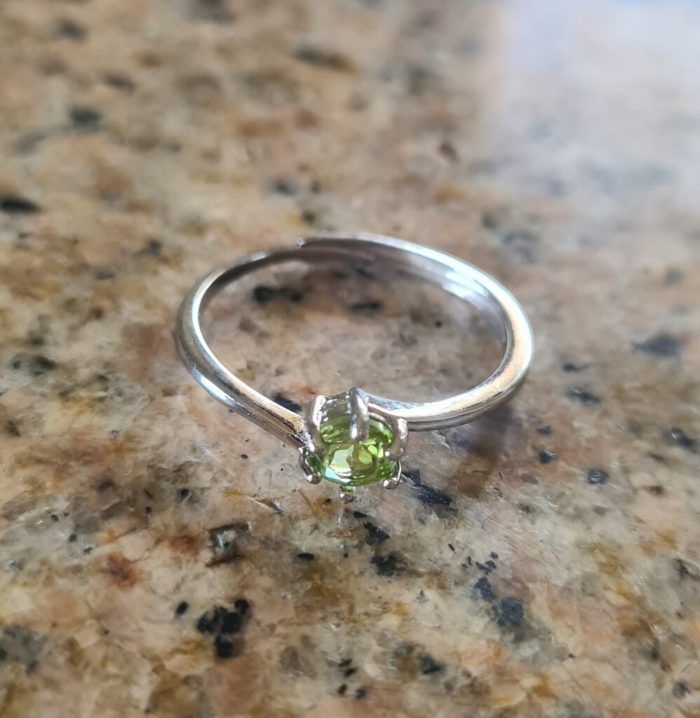 Jemagic Peridot Ring on Granite Rock