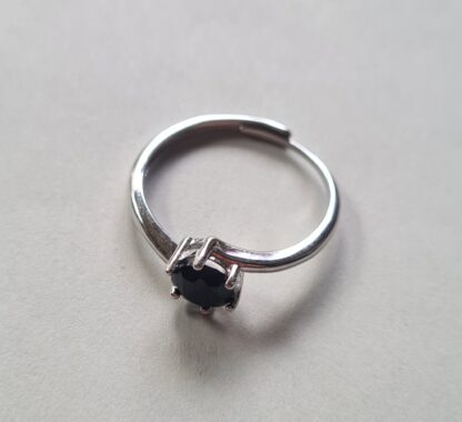Jemagic black spinel ring on a silver background