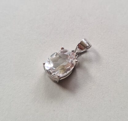 Jemagic white topaz pendant on silver background - Side View