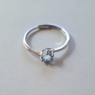 5mm Jemagic blue topaz ring on silver background