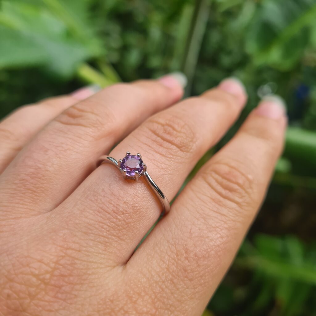 Jemagic amethyst ring on middle finger
