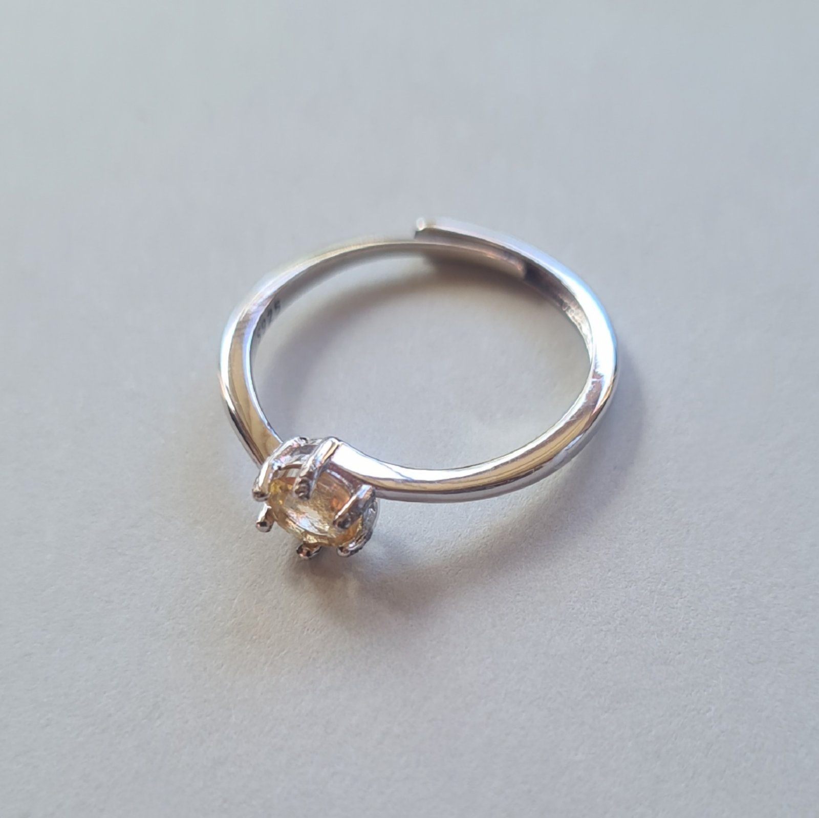 5mm Jemagic citrine ring on silver background - side view 5mm Jemagic citrine ring on silver background - side view