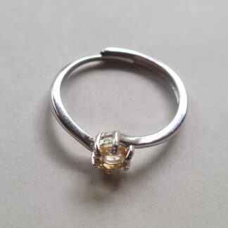 Jemagic citrine ring on silver background.