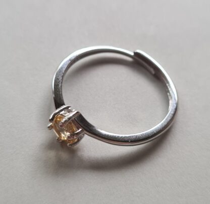 Jemagic citrine ring on silver background - side view