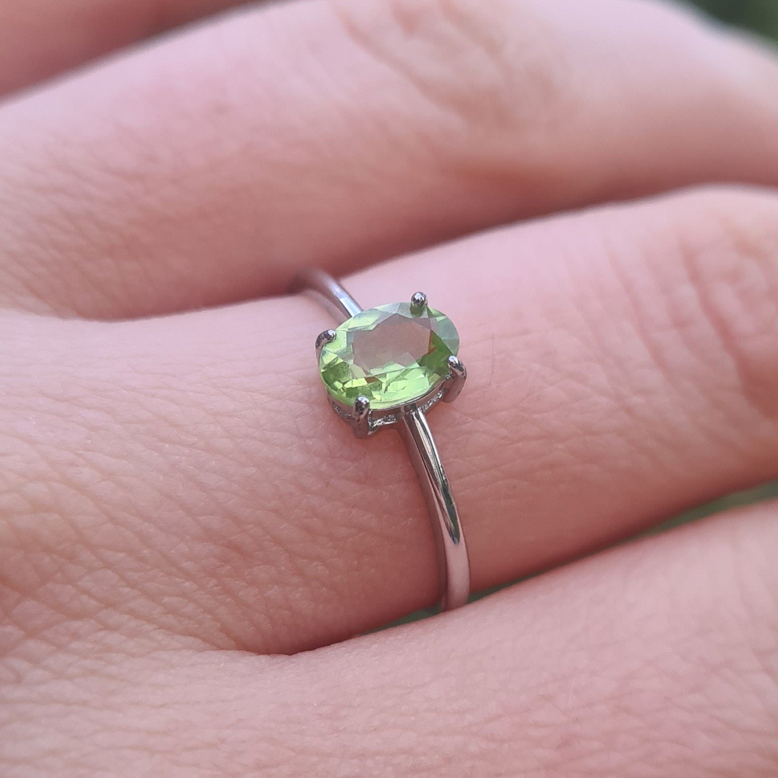 oval cut peridot on finger Jemagic oval cut peridot ring on finger
