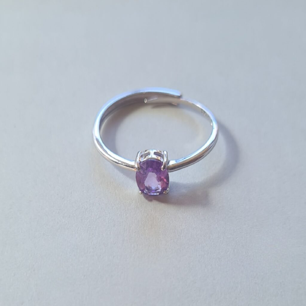 oval cut Jemagic amethyst ring on silver background