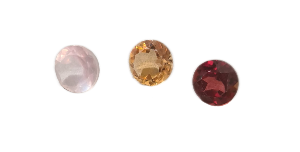 A rose quartz, citrine, and garnet gemstone